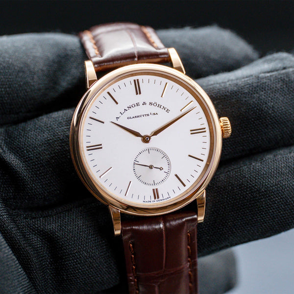 Front view of A. Lange & Sohne Saxonia 219.032 Rose Gold in gloved hand